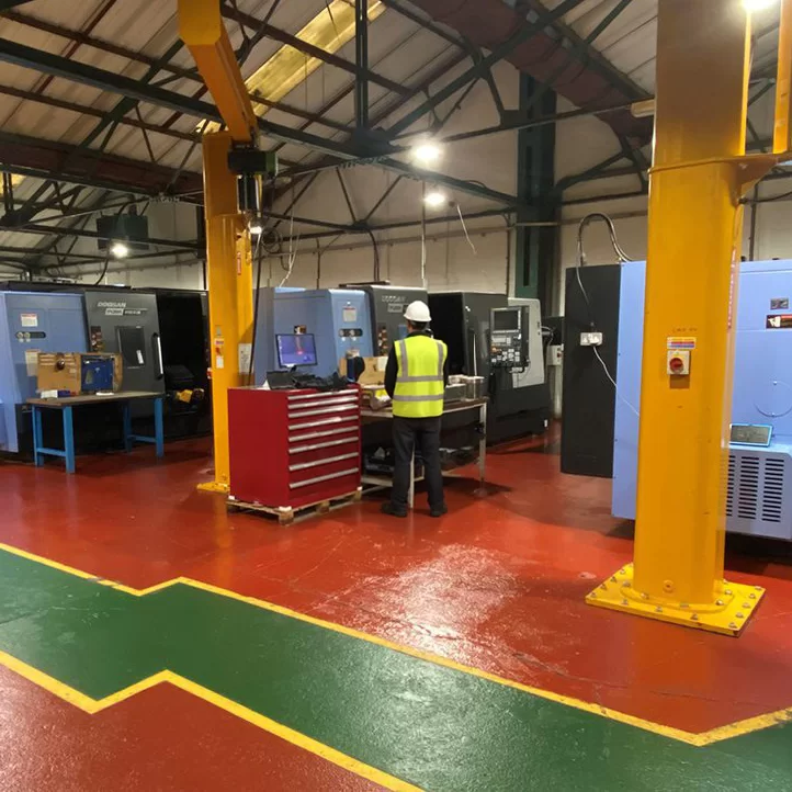Engineer working at a CNC machine in the Cardan workshop